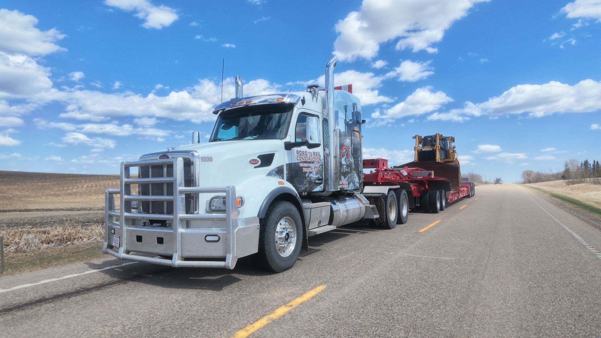 Lowbed hauling equipment on an Alberta highway