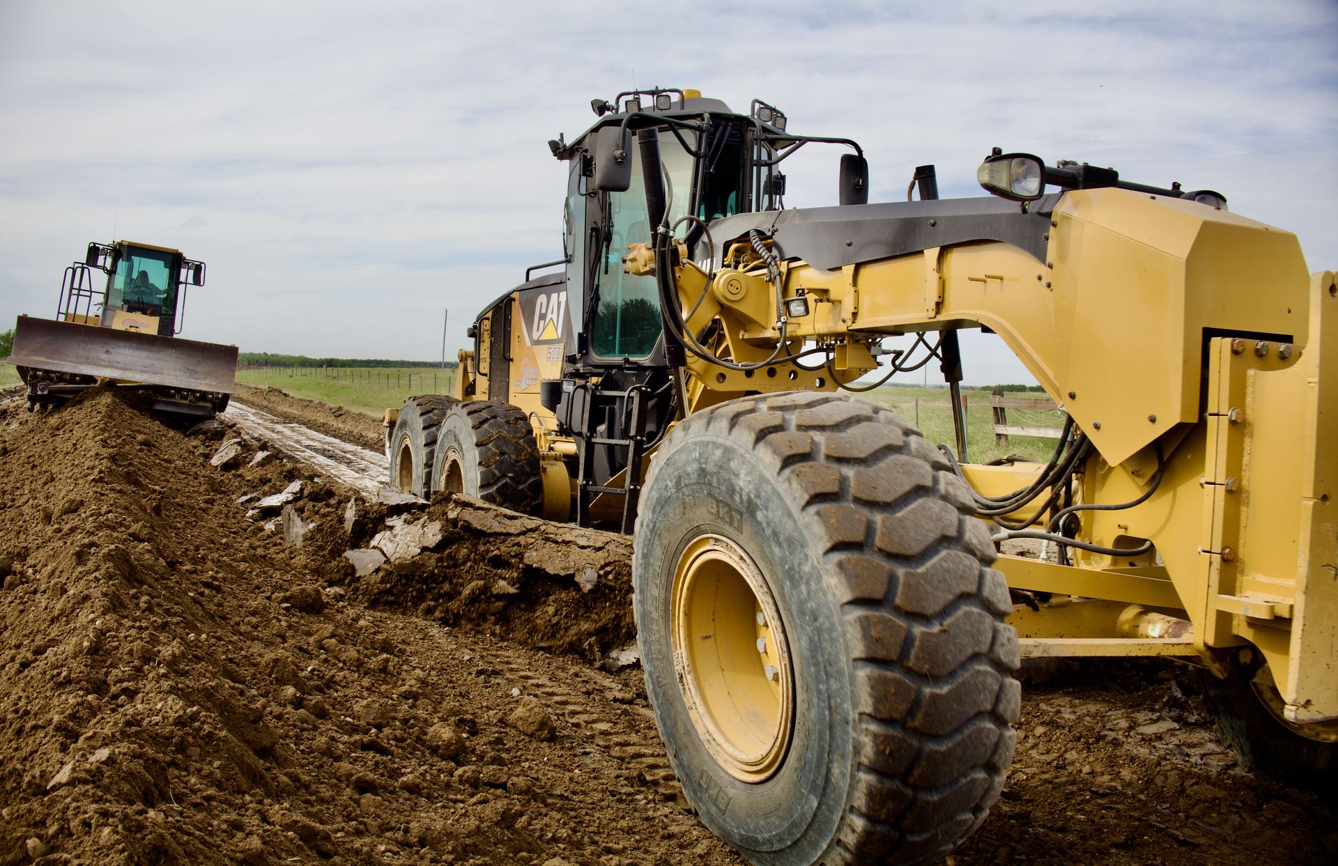 Motor grader building a road in Alberta