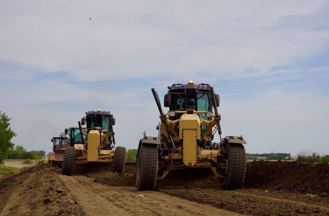 Graders pulling shoulders in Camrose County
