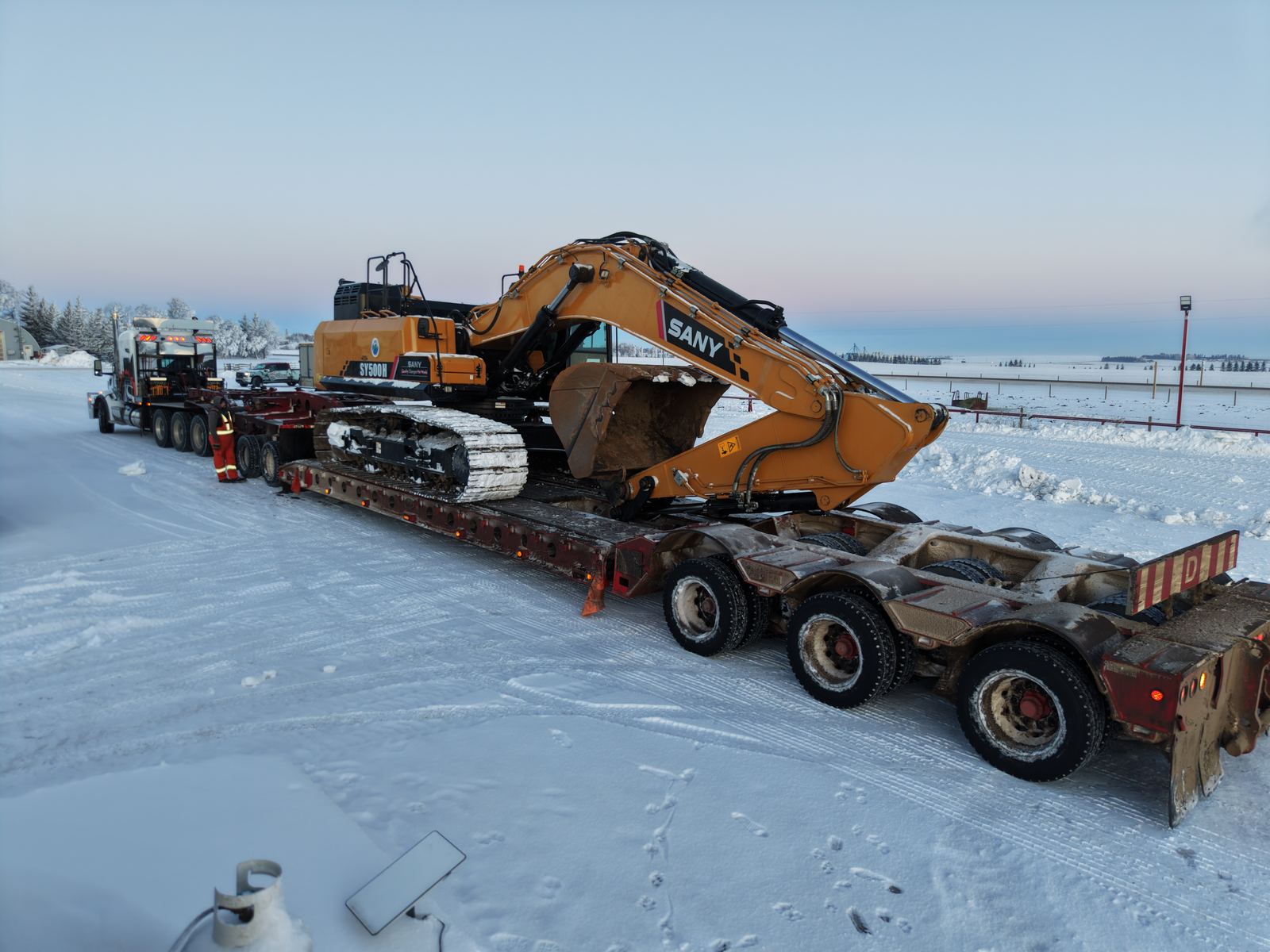 The SANY SY750 moving between projects